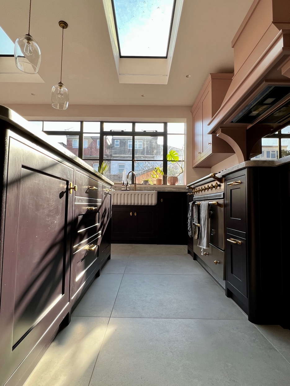 Kitchen corridor showing depth of the room and cabinetry